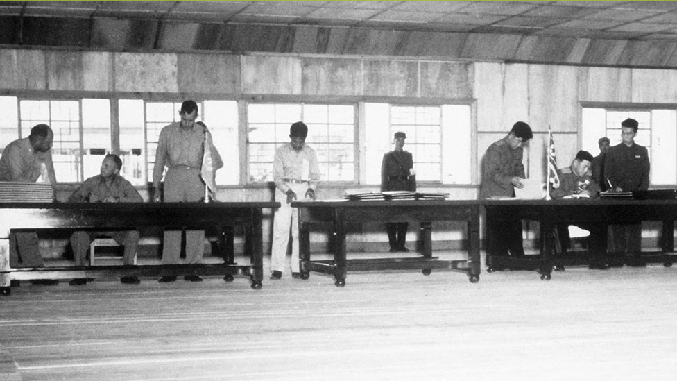 Signing the Armistice which led to a ceasefire in July 1953